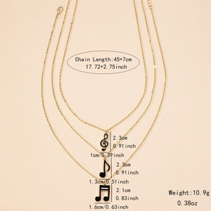 Three-layer music note pendant necklace set with G-clef in gold-tone finish