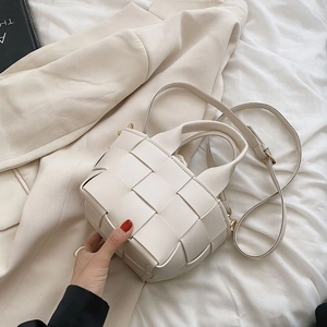 Chic cream white woven tote bag with round handles and detachable crossbody strap