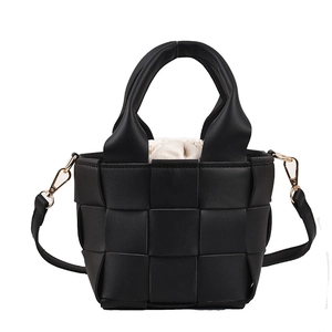 Fashionable black woven faux leather handbag with drawstring canvas liner and shoulder strap