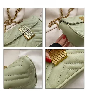 Detail view of light green quilted crossbody bag with chevron pattern and gold lock