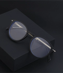 Detailed macro view of retro round glasses model DB1049 showing size dimensions 52-16-141
