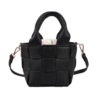 Classic black woven handbag with dual handles and gold buckle strap