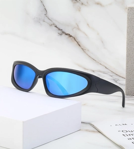 Detail of matte black sports sunglasses with blue reflective lenses on a marble background