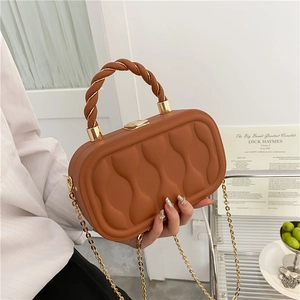 Caramel box crossbody bag with wavy quilted texture and golden chain strap