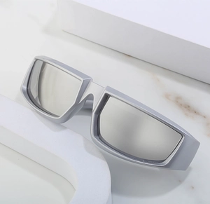 Detail of futuristic silver cycling sunglasses on minimalist white geometric platforms