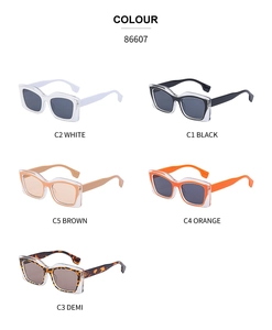 Cat eye sunglasses featuring a layered frame design in white black brown orange and demi