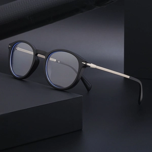 Retro round frame sunglasses with matte black rims and silver metal temples for outdoor use