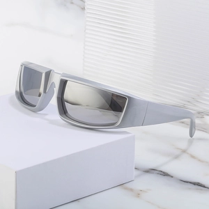 Futuristic silver steampunk sunglasses with grey lenses on white geometric block