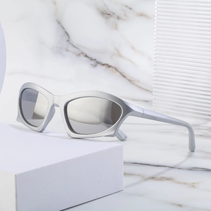 Futuristic silver wraparound Y2K sunglasses with metallic frame and reflective lenses