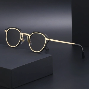 Retro cat-eye sunglasses with black and gold frames for a trendy vintage look