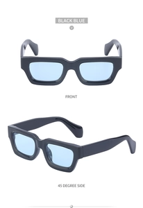 Close-up of steampunk square sunglasses with thick black frames and light blue lenses