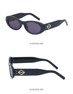 Détails de lunettes de soleil ovales noires avec ornements métalliques dorés en losange