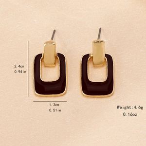 Geometric hollow square drop earrings in gold metal with dark brown enamel finish