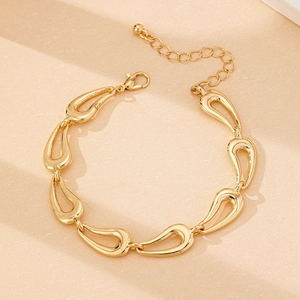 Detail of gold teardrop link bracelet with lobster clasp and adjustable extender chain