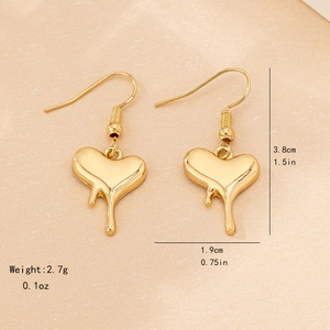 Golden liquid heart drop earrings with size measurements on elegant paper background