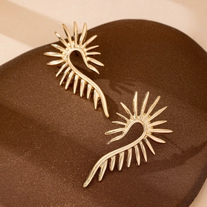 Fashionable gold radial sunburst stud earrings with unique artistic linear design