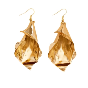 Elegant gold petal drop earrings with irregular hammered texture and curved organic shape