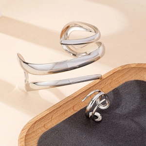 Minimalist silver spiral wrap bracelet and matching ring set with high polish finish