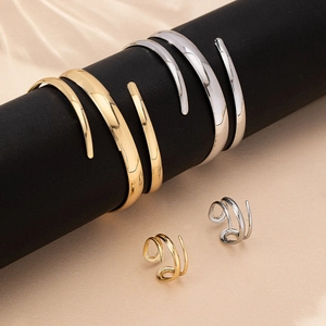 Chic hollow teardrop jewelry set with gold and silver adjustable bangles and spiral rings