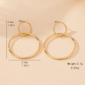Minimalist gold double circle drop earrings with textured twist and smooth finish