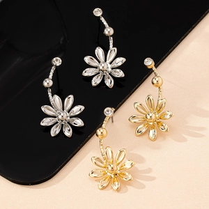 Elegant daisy drop earrings in gold and silver finish with sparkling rhinestone accents