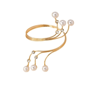 Elegant gold spiral arm cuff bracelet with white pearls and sparkling rhinestones