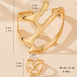 Irregular golden cuff bracelet and ring set with minimalist hollow organic design