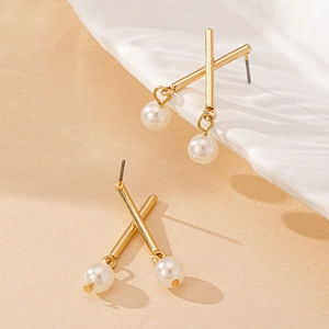 Elegant gold X-shaped stud earrings with round white pearl pendants for a modern look