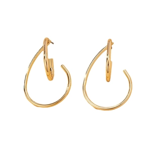 Minimalist geometric crisscross earrings in polished gold metal with a modern design