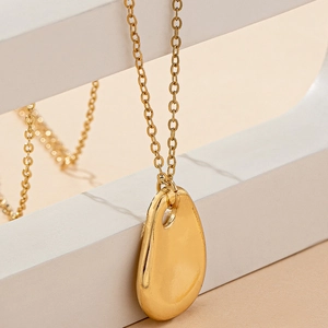 Elegant gold-tone irregular water drop pendant necklace with a fine cable chain for women