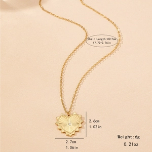 Golden sunburst heart pendant necklace with zircon stone on minimalist chain