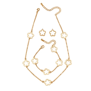 Golden hollow clover jewelry set with matching necklace bracelet and stud earrings