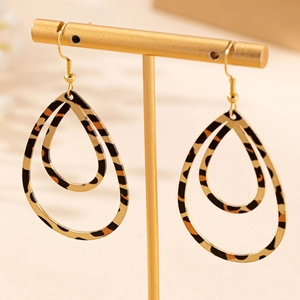 Fashionable leopard print teardrop earrings on a gold stand with a minimalist design