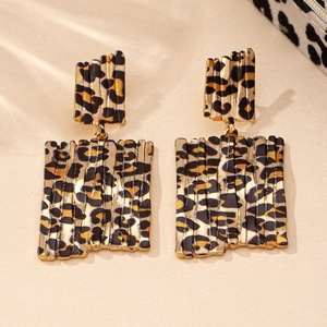 Detailed view of square leopard print earrings with double wave-textured geometry