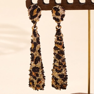 Elegant gold drop earrings with textured leopard print and vintage lava finish style