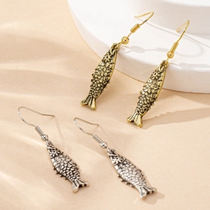 Artistic fish-shaped drop earrings in vintage gold and silver finishes with scale details