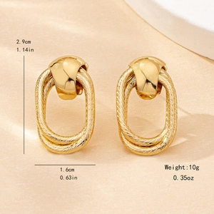 Elegant gold geometric earrings with twisted texture and oval hollow design, 2.9cm length