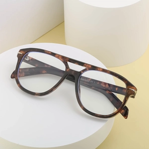 Vintage double bridge tortoise shell oval sunglasses with brown amber textured frame