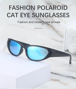 Detail view of Y2K cat eye sunglasses with black matte frame and blue polarized mirror lens