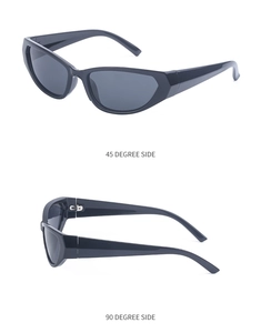 Detail view of black Y2K cat-eye sunglasses with silver hinges and dark lenses