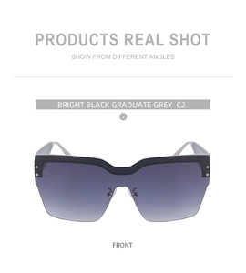 Vue frontale de lunettes de soleil oversize demi-cerclées noires avec verres dégradés gris foncé