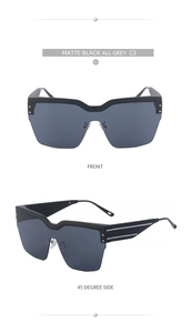 Détails des lunettes de soleil oversize noir mat avec rivets argentés et verres gris