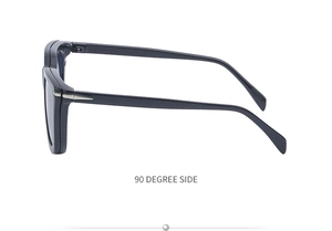 Detail view of the 90-degree side profile of black magnetic frame glasses with silver arrow