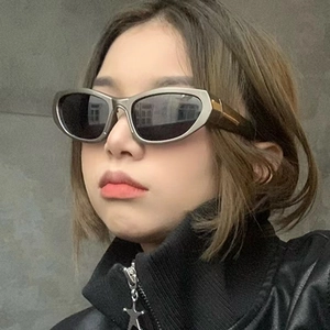 Y2K polarized oval sunglasses with silver metallic frames worn by a female model