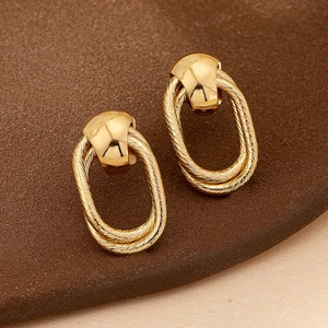 Elegant gold hollow geometric stud earrings with braided texture in vintage style