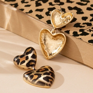 Elegant double leopard print heart earrings with a gold-tone metallic backing