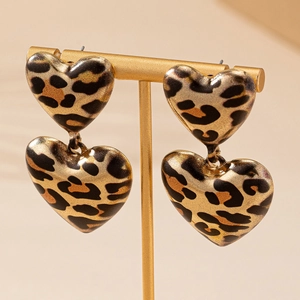 Elegant double heart drop earrings with vintage leopard print and golden metallic finish