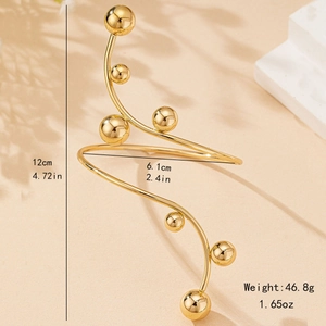 Chic gold spiral cuff bracelet featuring polished metal beads in a modern minimalist design