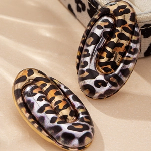 Elegant geometric oval leopard print earrings with a layered gold-tone alloy design