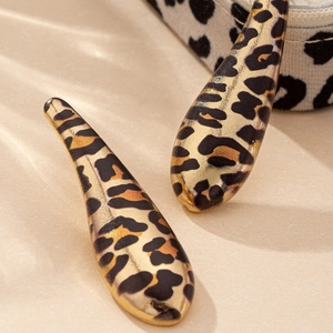 Elegant teardrop leopard print earrings with a polished gold-tone metal finish
